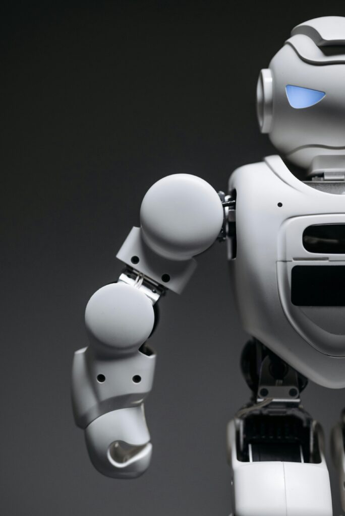 Close-up of a sleek and futuristic robot arm, highlighting advanced robotics design.